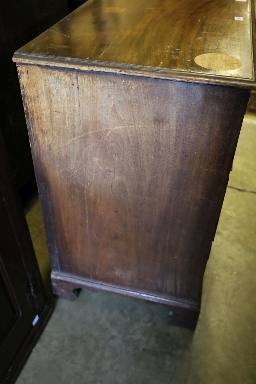 A George III mahogany chest of drawers, with brushing slide, width 90cm depth 49cm height 84cm